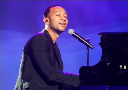 Singer John Legend performs at the annual shareholders meeting for Walmart in Fayetteville, Arkansas June 7, 2013. Wal-Mart Stores Inc's board approved a $15 billion stock repurchase plan, its first in two years, the world's largest retailer announced at its annual meeting on Friday. REUTERS/Rick Wilking (UNITED STATES - Tags: BUSINESS ENTERTAINMENT) - RTX10FGA
