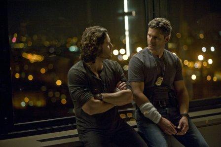 Sarchie (Eric Bana) confesses his past deeds to Mendoza (Edgar Ramirez) in Screen Gems' DELIVER US FROM EVIL.