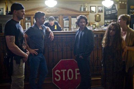 Butler (JOEL McHALE), Sarchie (ERIC BANA) and Mendoza (EDGAR RAMIREZ) with Jane Crenna (OLIVIA HORTON) is brought into the precinct in Screen Gems' DELIVER US FROM EVIL.