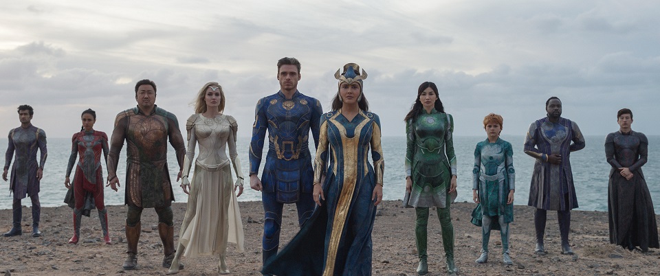 (L-R): Kingo (Kumail Nanjiani), Makkari (Lauren Ridloff), Gilgamesh (Don Lee), Thena (Angelina Jolie), Ikaris (Richard Madden), Ajak (Salma Hayek), Sersi (Gemma Chan), Sprite (Lia McHugh), Phastos (Brian Tyree Henry) and Druig (Barry Keoghan) in Marvel Studios' ETERNALS. Photo courtesy of Marvel Studios. ©Marvel Studios 2021. All Rights Reserved.